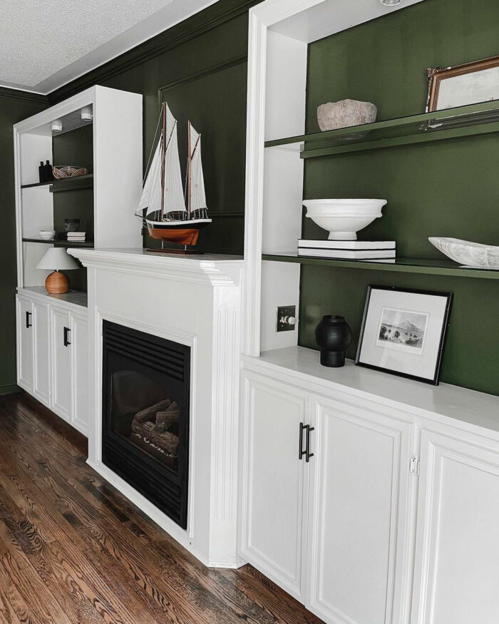 Shelves near fireplace painted with Sherwin-Williams paint colors in popular 2024 green option alternative to gray