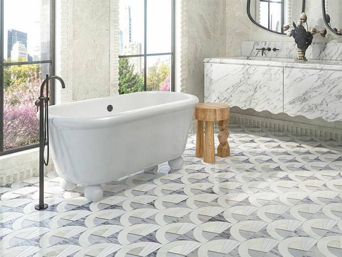 White bathroom with mosaic tiles and white soak tub White bathroom with mosaic tiles and white soak tub