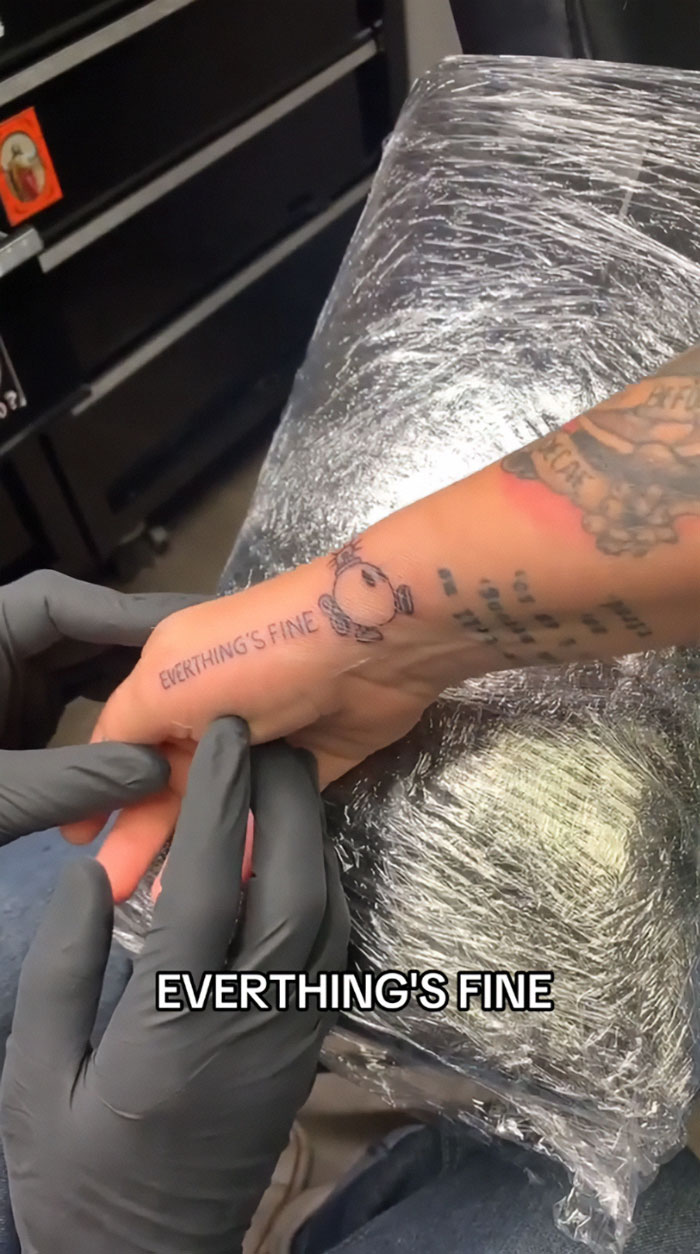 Tattoo mistake on arm with text "EVERTHING'S FINE" causes viral moment on TikTok, sparking artist's crisis.
