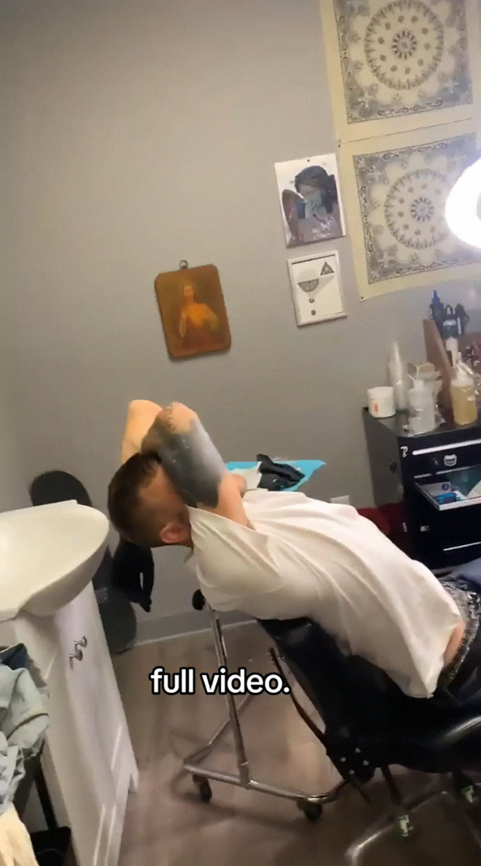 Tattoo artist in studio, reflecting on tattoo blunder seen on TikTok video.