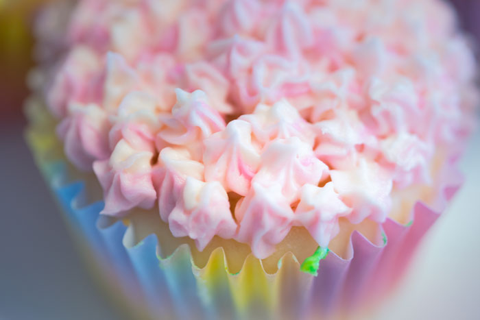 Close-up of a cupcake with pink and white frosting, highlighting a cooking fail shared by an online community forum user.