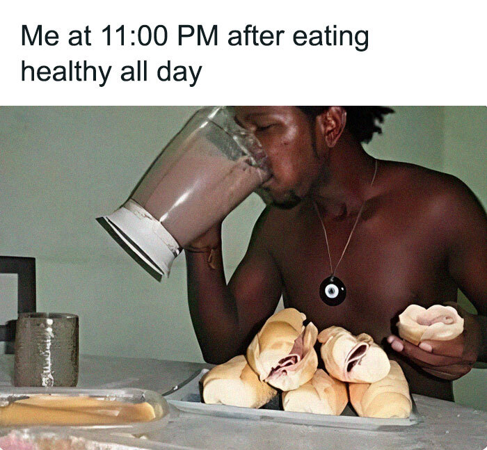 Shirtless man indulging in late night snacks with a blender full of chocolate shake, humorously highlighting diet challenges.