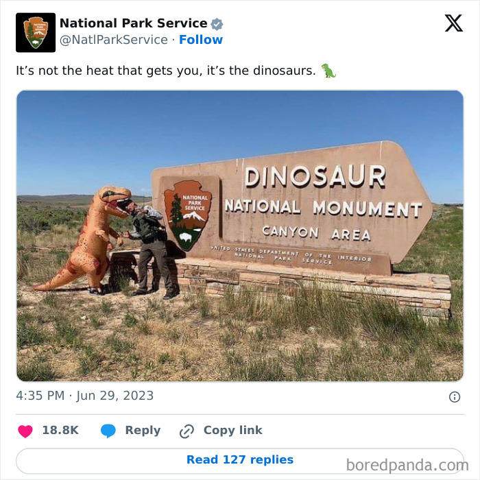 National Park Service tweet with a ranger in a dinosaur costume posing next to Dinosaur National Monument sign.