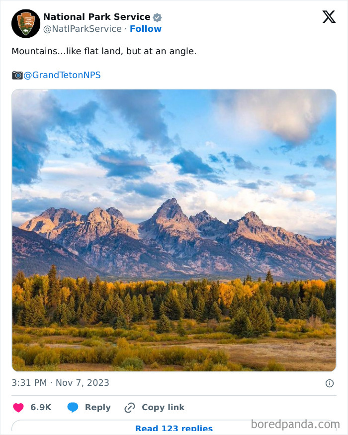 National Park Service tweet showing colorful mountain range with forest under a cloudy blue sky at sunset.