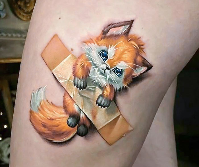 3D tattoo of a cute orange fox with blue eyes, appearing taped to the skin, showcasing impressive tattoo artistry.
