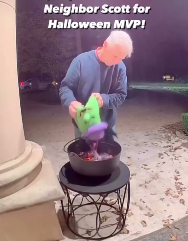 Man burning Halloween candy outside at night after family took all candy meant for trick or treaters on Halloween. Man burning Halloween candy outside at night after family took all candy meant for trick or treaters on Halloween.