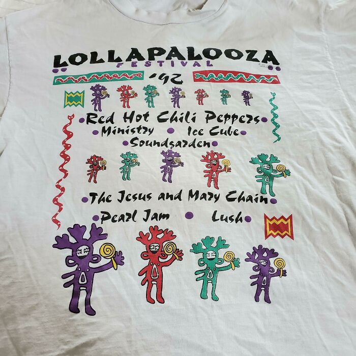 90s Lollapalooza festival t-shirt featuring band names like Red Hot Chili Peppers, Pearl Jam, and Soundgarden.