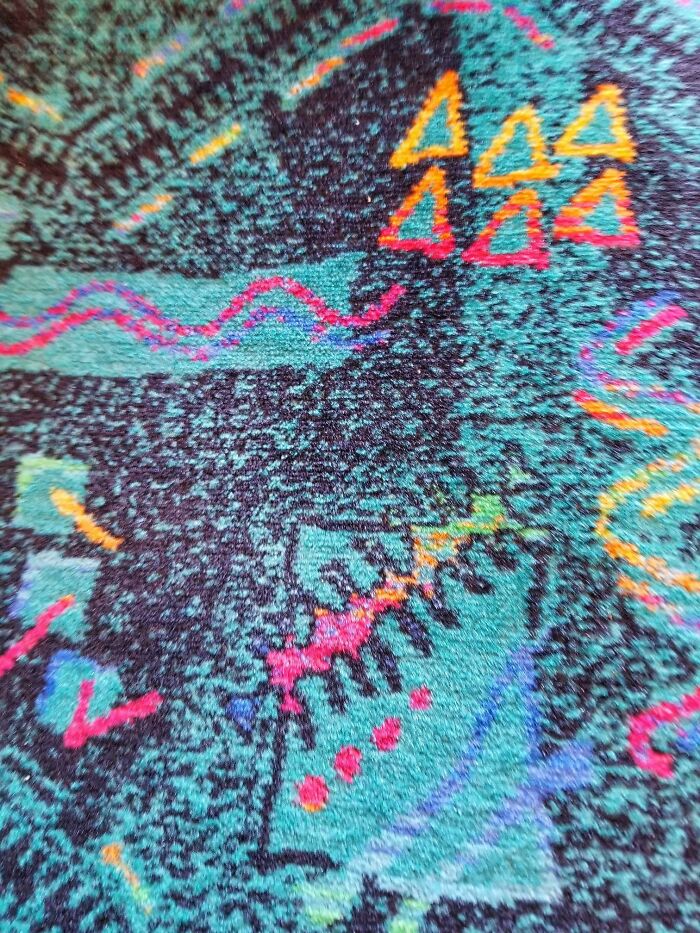 Colorful retro '90s pattern with abstract shapes and zigzags on fabric background.