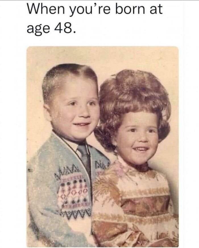 Vintage photo of two children with adult-like hairstyles, humorously illustrating the concept of getting old faster.