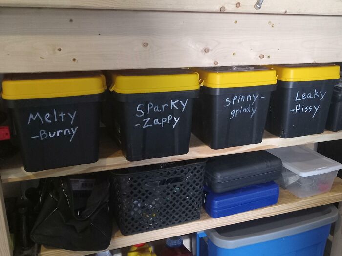 Storage bins with humorous labels like "Melty-Burny" and "Sparky-Zappy," showcasing parents' sense of humor.
