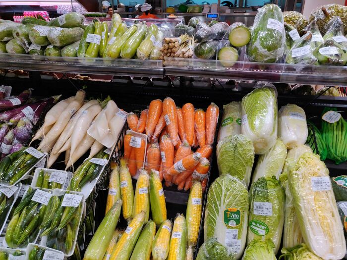 Individually Wrapped Vegetables In A Vietnamese Supermarket