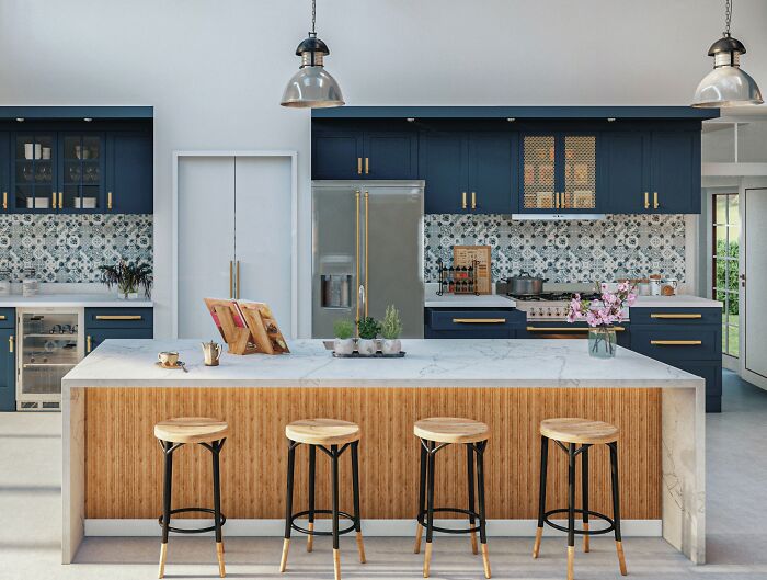 Kitchen with blue cupboards and marble table