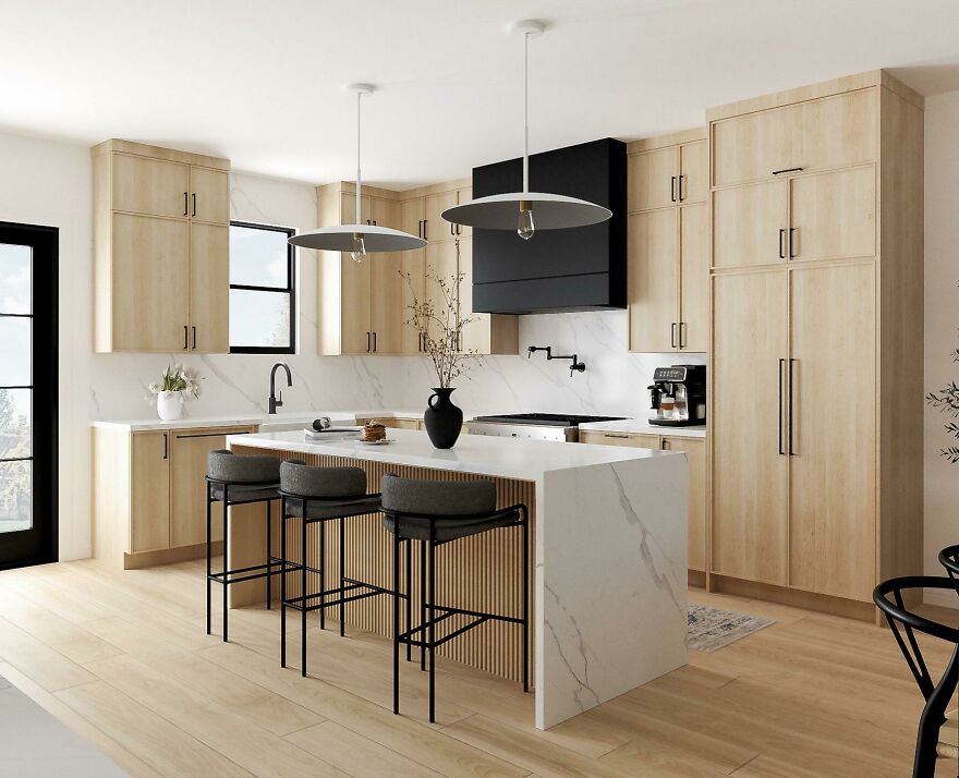 Natural wood kitchen cabinets with a modern design, featuring a white marble island and contemporary pendant lighting.