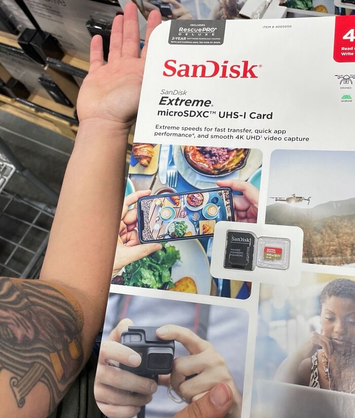 SanDisk microSD card packaging fail with card stuck in hard-to-open plastic, causing frustration and confusion.
