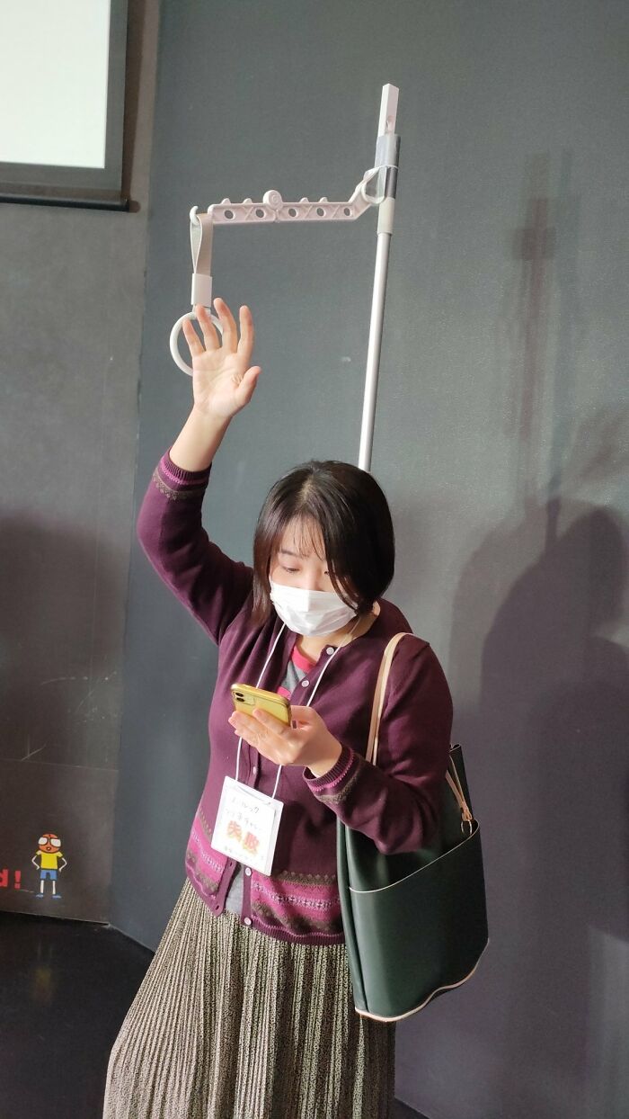 Person Who Tries To Reach For Subway Handle Without Taking Eyes Off Their Phone And Misses