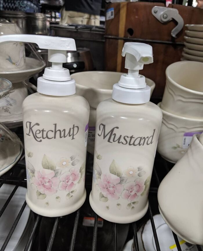 Ceramic ketchup and mustard dispensers with floral designs among weird thrift store donated items.