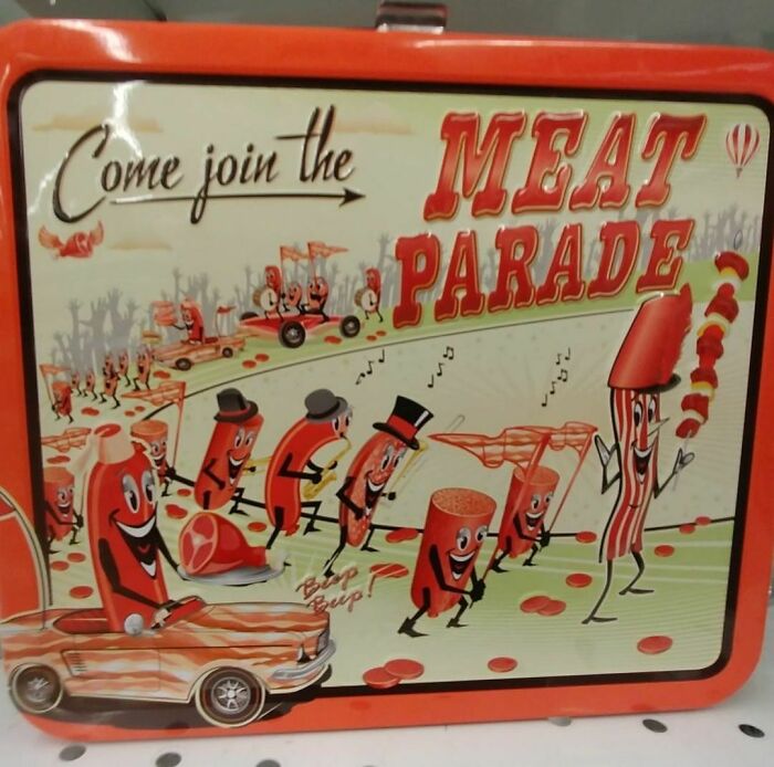 Vintage metal lunchbox featuring animated meat characters in a playful meat parade, a weird thrift store donated item.