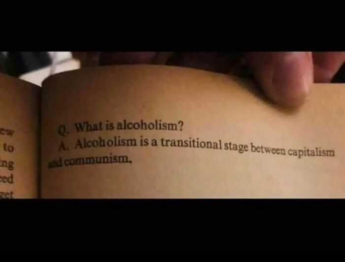 Text on a book page humorously defining alcoholism as a transitional stage between capitalism and communism in confusing pics.