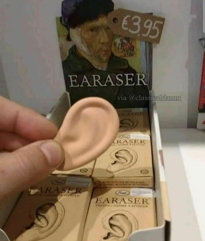 Hand holding an ear-shaped eraser in a box labeled earaser, a hilarious and confusing novelty item.