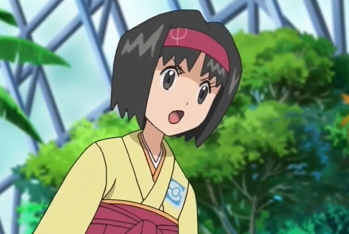 Erika with her mouth open in green background - 67