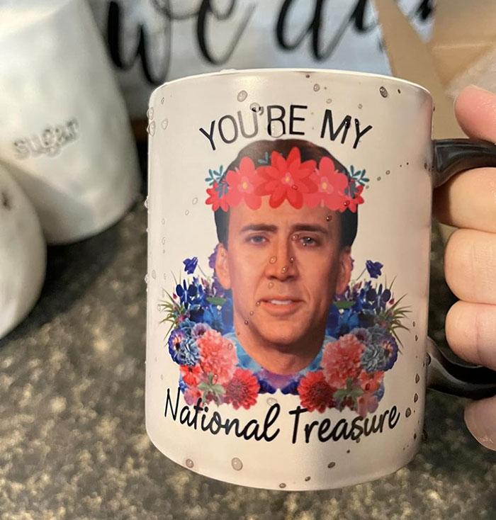 Novelty mug with floral design and humorous face, ideal for unconventional presents for friends.