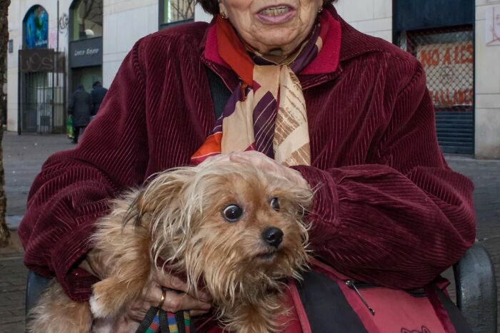A Photograph Of A Woman With A Dog
