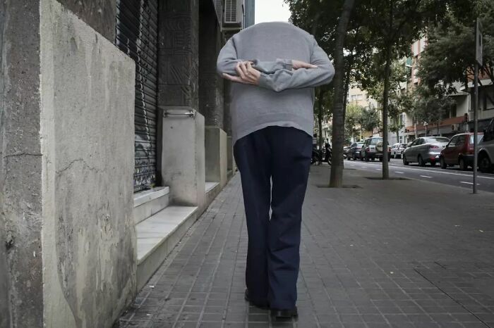 A Photograph Of An Old Man Walking