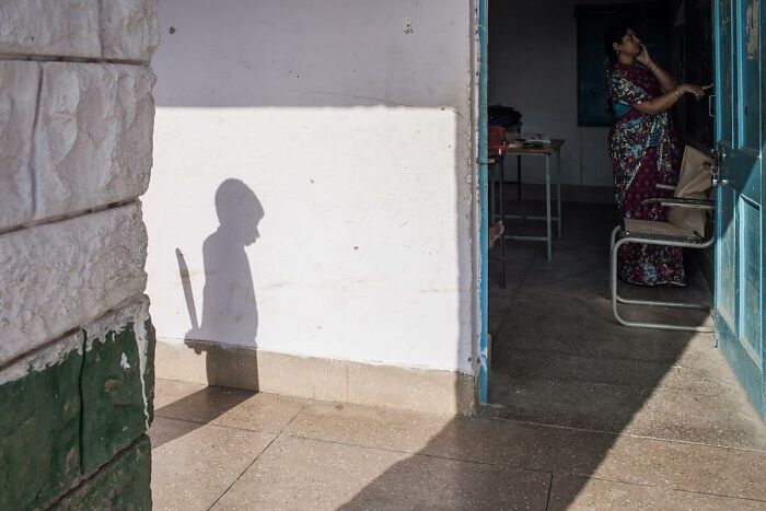 A Photograph Of A Boy's Shadow Outside