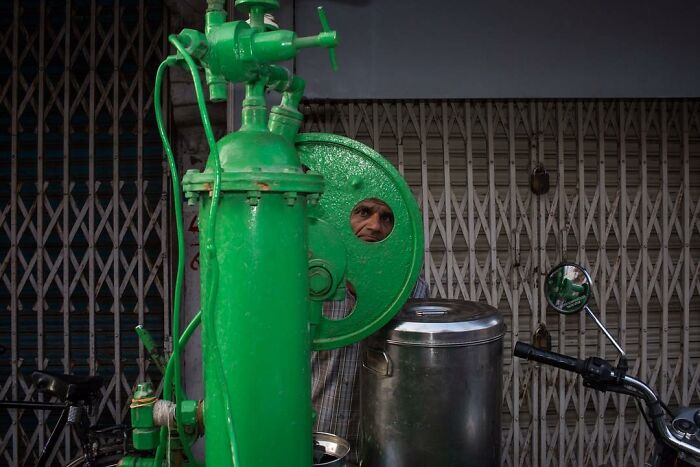 A Photograph Of Man's Head Peeping