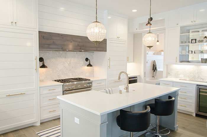 Photo of white kitchen interior.