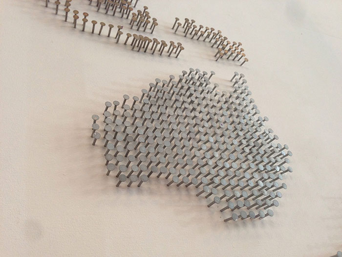 Nail wall art map creating a modern and creative decor piece for a stylish space with unique wall art ideas.