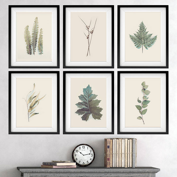 Six framed leaves wall art displayed above a mantel, showcasing creative wall art ideas for a stylish space.