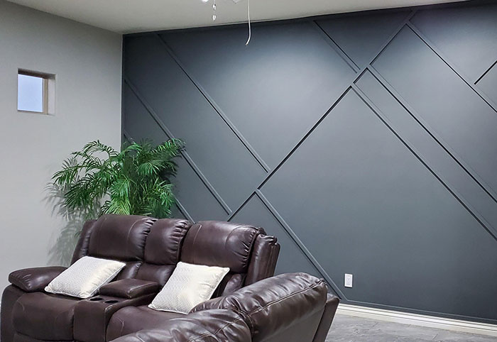 Light blue geometrical wall molding adding a creative and stylish wall art idea to the modern living room space