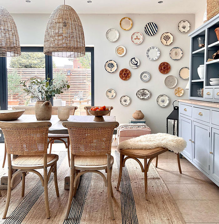 Vintage plates wall art displayed in a dining room, showcasing creative wall art ideas for a stylish space.