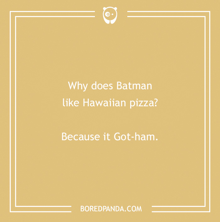Batman joke about Hawaiian pizza on a tan background with text: "Why does Batman like Hawaiian pizza? Because it Got-ham."