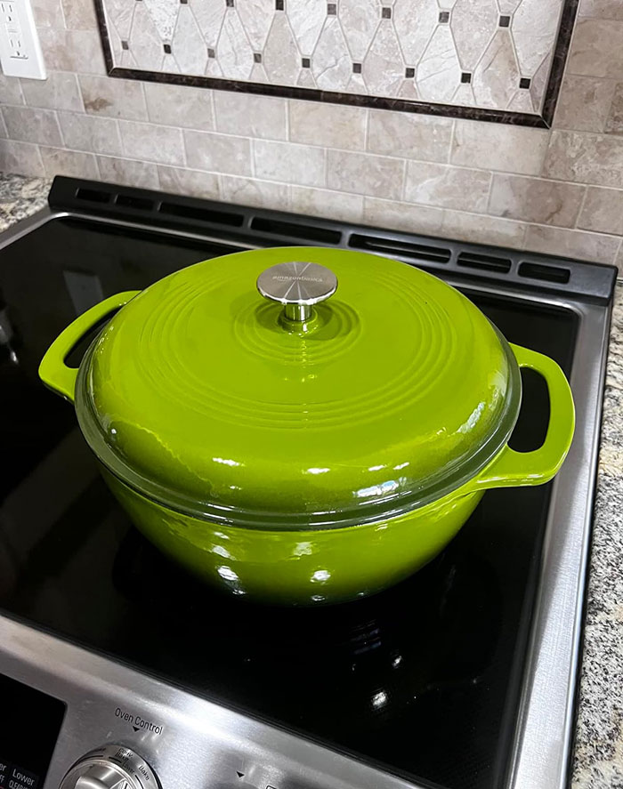 Enameled Cast Iron Covered Round Dutch Oven: Perfect for cooking versatile dishes with its heat-retaining cast iron and easy lift handles—it's a must-have culinary rockstar you should add in your kitchen arsenal, stat!