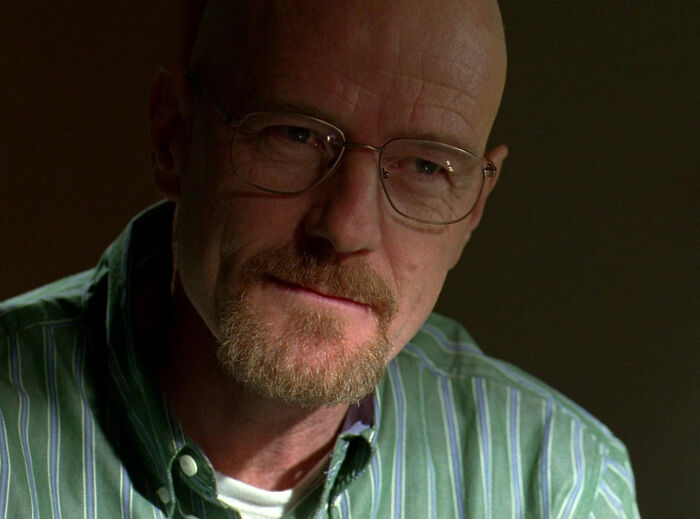 Walter White wearing green shirt looking
