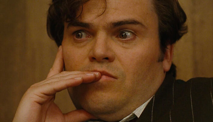 Carl Denham looking from King Kong