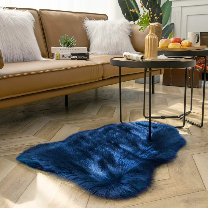 Room with blue rug and sofa showcasing stylish dining room ideas to beautify family gatherings and parties.