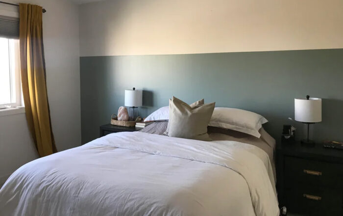 Bed with white linen and pillows