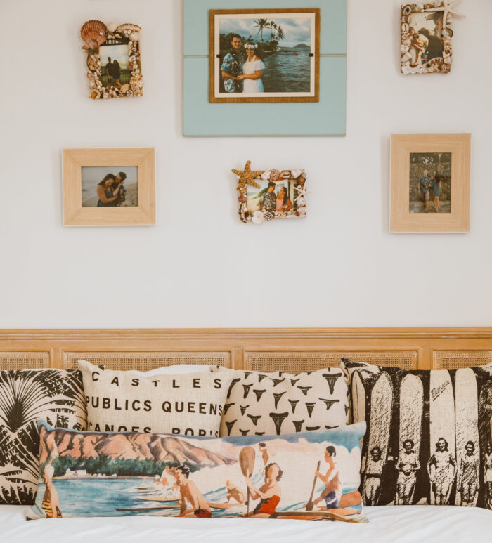 Pillows near the wall with photo frames