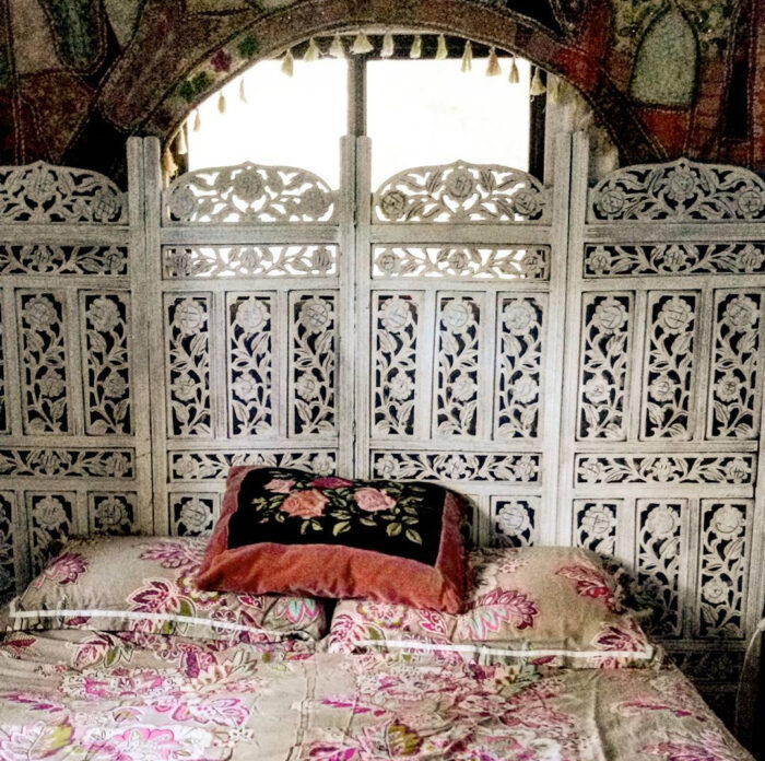 Folding screen near the bed