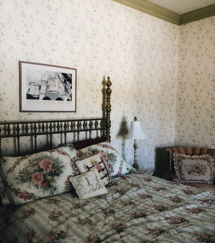 Bed with floral bed linens