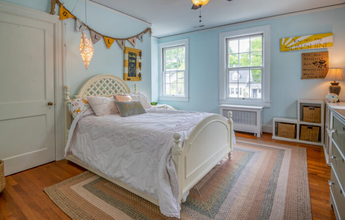 White bedframe in a bedroom