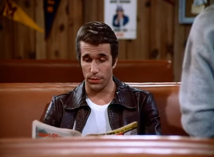 Fonzie reading newspaper from Happy Days