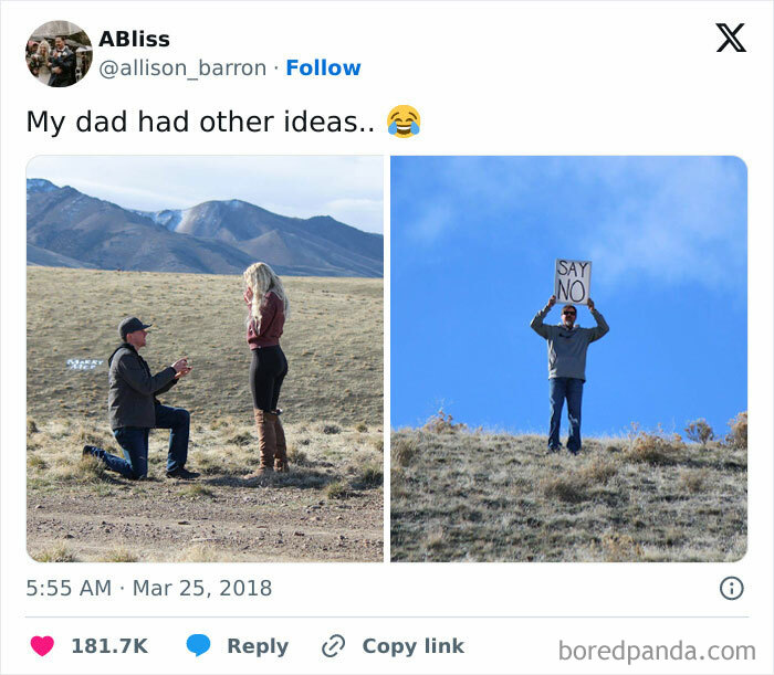 Man proposing; in background, dad humorously holds a "Say No" sign.