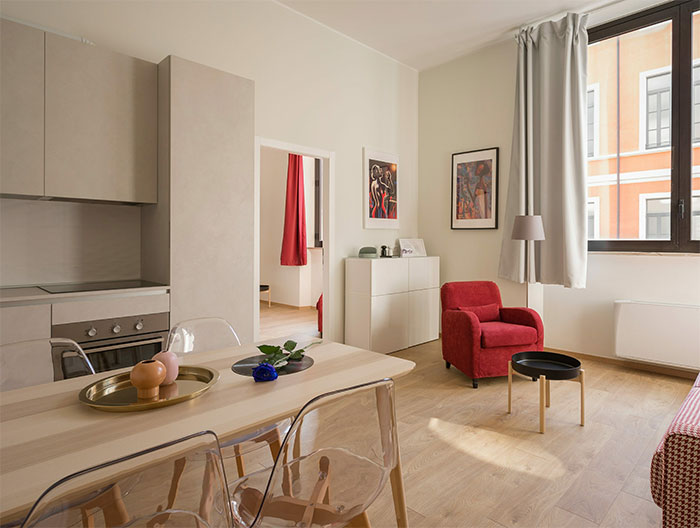 White tidy room filled with white and red furnitures