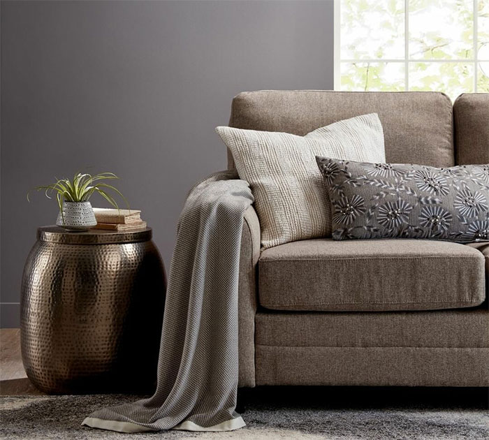 Room with yellow vase sofa and cadet gray color walls