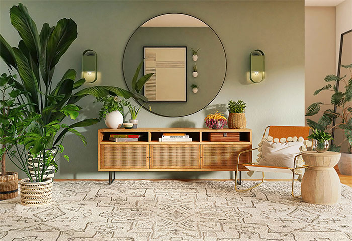Light green room with wooden cupboard, plants, and cozy seating highlighting happy color to transform home and bring joy