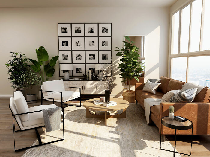 Room featuring a brown couch, white chairs, and a brown table near large windows showcasing expert-approved interior design ideas.